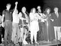 1. The Gang of Four at a downtown press conference in the 1980s. From left: Laurie Dittman, Art Johnston, Rick Garcia and Jon-Henri Damski. 2. A Gay and Lesbian Town Meeting gathering in the 1980s, pushing for gay rights. From left: Rick Garcia, Laurie Dittman, Jonathan Katz and Irwin Keller. 3. The Third Annual Lesbian Conference, in Chicago in 1990. Pictured from left are Leslie, Judy, Kitty and Lola. Photo by Tracy Baim. 4. A Mountain Moving Coffeehouse show. Mountain Moving was the longest continuously operating women's coffeehouse in the world when it closed in the early 2000s. It had started in the 1970s. Photo by Tracy Baim. 5. LLENA, the Latina lesbian group of the 1980s. Photo by Tracy Baim. 6. After the gay-rights ordinance failed in a July 1986 vote, thousands of gays and their allies gathered at Daley Plaza downtown for a rally, singing "We Shall Overcome." From left: Jon Simmons, Achy Obejas, Dewey Herrington, Kit Duffy, Chris Cothran, Rev. Ninure Saunders and Jim Flint. Photo by Tracy Baim. 7. 1980s protest. Photo by Steve Arazmus. 8. Lori Cannon in the 1980s. 9. The Dr. Tom Waddell panel on the NAMES Project AIDS quilt in Chicago, late 1980s. 10. Horizons' board photo 1989. Photo by Tracy Baim. 11. Open Hand Croquet benefit 1980s: Greg Harris, Melissa Anderson and Richard Knight Jr.. 12. Anti-violence protest. 13. Mayor Harold Washington with his COGLI gay group 1986. 14. Chicago House: Diane Kavilla, Mike Simanowicz and Jackie Sapian, 1980s. 15. Joanne Trapani and Al Wardell of the Illinois Gay and Lesbian Task Force with an anti-bullying poster. 16. 1987 March on Washington Chicago gathering. 17. Larry McKeon, Jan Dee, Joanna Trapani and Tom Chiola. 18. Women & Children First Bookstore 1980s, from left: Starla Sholl, Yvonne Zipter, Ann Christophersen, Florencia Carolina, and Linda Bubon. 19. Ald. Bernie Hansen  ( left )  confronted by candidate Dr. Ron Sable  ( right ) , 1980s. 20. American Library Association gathering, from left: David Feinberg, Barbara Gittings, Roland Hansen, Armistead Maupin and Bill Bergfalk. Photo by Jorjet Harper.