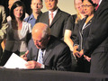 Quinn signs the anti-bullying measure in June. Photo by Sam Worley