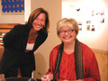 Molly Ivins (right) with Women & Children First Bookstore co-owner Linda Bubon at a book signing at the store in October 2003. Photo by Tracy Baim