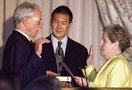 James Hormel is sworn in as a recess appointment as U.S. Ambassador to Luxembourg, in 1999. Secretary of State Madeleine Albright did the honors, and Hormel's former partner Tim Wu held Hormel's father's Bible for the event. Press photo