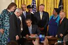 Obama signs executive order. Photo by Patsy Lynch
