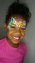 Emoji face paint on a little girl. Photo by Lea Selley 