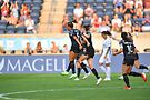 The Red Stars' Mallory Pugh (wearing number nine) and teammates celebrate. Photo courtesy of ISI
