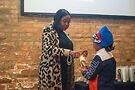 Zahara Bassett helps light a candle with the nephew of Disaya Monaee Smith. Photo by Max Lubbers