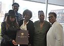 Renee Greenwood, Dr. Benton Johnson, Carolyn Schanette, Charlotte Walker and Gail Collier with Gloria Allen's proclamation. Photo by Vern Hester