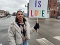 AJ Paramo holding a Love is Love sign at protest. Photo by Carrie Maxwell