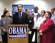 Lauren Verdich, fourth on right of center, in red, at a 2003 press conference when Barack Obama was running for U.S. Senate. Photo by Tracy Baim